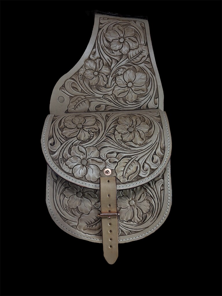 A tooled leather satchel made with MTL veg tan leather.