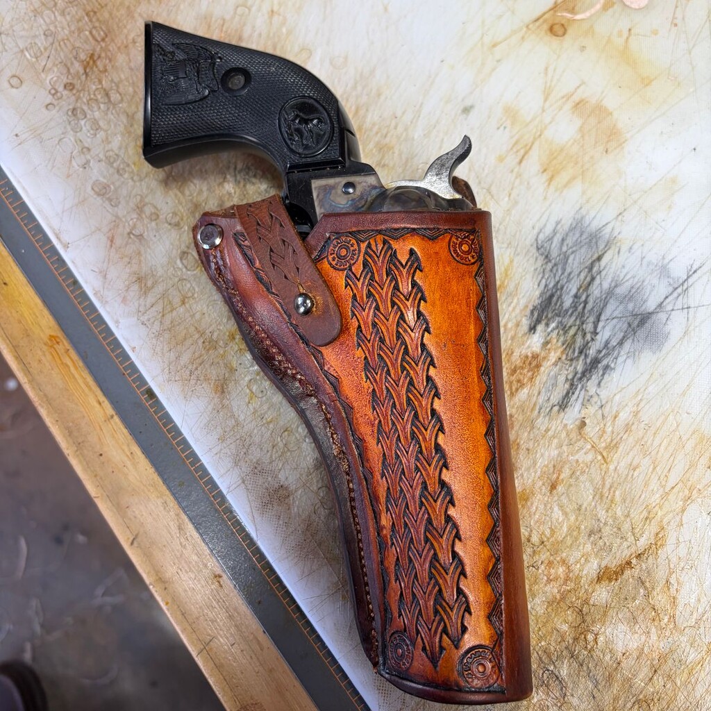 A holster made with MTL veg tan leather.