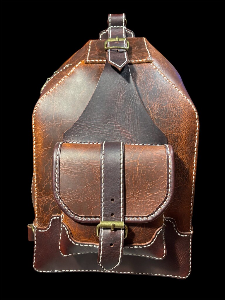A leather bag made with olmo and cordovan smoked veg tan leather.