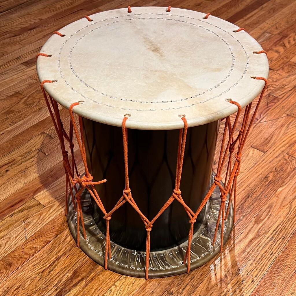 A hand drum made with white cow rawhide.