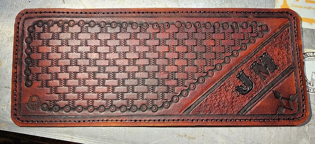 A trifold wallet made from MTL veg tan leather.